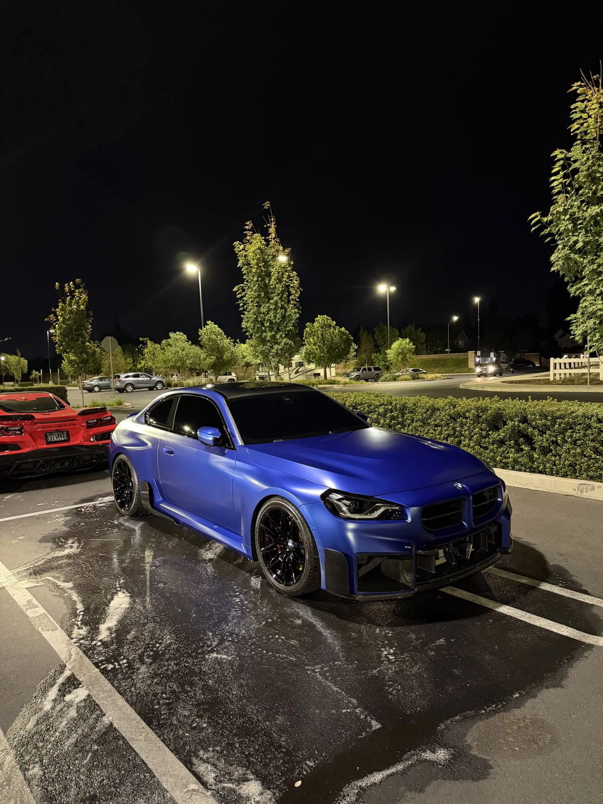 Blue BMW photographed at night